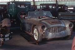 Swan Hill, Victoria, Australia, 1975 - An Austin-Healey 100 Six of 1957 due for restoration in the car museum of the Pioneer Settlement open air museum.