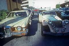 Beverly Hills, California, USA, 1980 - Car yard with modern retro-styled “classic” cars; at right an Excalibur.