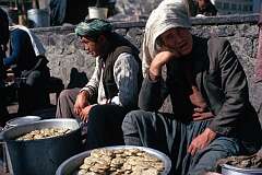 A man is selling biscuits on a street market along busy Jadi Maiwand, the main avenue of Kabul.