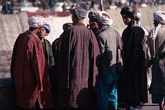 A group of Pashtu (or Pathan) men having a discussion on the street. The Pashtun people are the dominant ethnic and linguistic community, about half the population of Afghanistan.