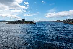 Looking back at Entrance Island Lighthouse from the Outer Bay at Macquarie Heads, the entrance to Macquarie Harbour.
