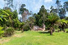 Ruins of Macquarie Harbour Penal Station, a former British colonial penal settlement on Sarah Island that operated between 1822 and 1833.