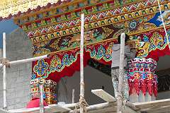 Painting the exterior of the new temple under construction  in the Lower Gompa, Gontse Gaden Rabgyel Ling Monastery.