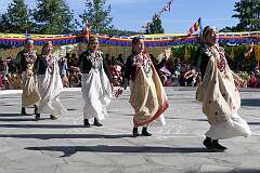 Young women perform a group dance.