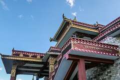 Roof decoration and Tibetan script at the Thupsung Dhargye Ling monastery and learning institute.