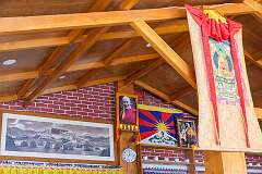 A photo of the Potala, the Dalai Lama and the flag of Tibet in Dharma Coffee House, in Tawang.