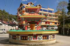 A Buddhist prayer wheel on a roundabout in the upper town of Tawang.