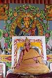 A throne, featuring a life-size cutout image of the 14th Dalai Lama, in the temple under the giant Buddha statue of Tawang.