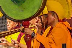 Playing drum and "dungchen", the long trumpet, in the Buddhist ceremony by monks of Tawang Monastery at the start of the Tawang Festival.