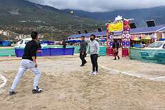 Men playing a traditional game, at the Tawang Festival showground.