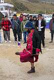 A woman playing “Thepi”, keeping a feathered ball as long as possible in the air by kicking, at the Tawang Festival.