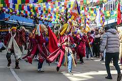 Monpa men dancing in the Carnival Parade on the first day of the Tawang Festival.
