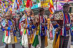 Men with headdresses, in the Carnival Parade on the first day of the Tawang Festival.