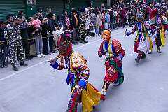 The Carnival Parade, with many colourful dancers, on the last day of the Tawang Festival.