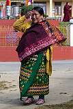 A woman arriving for the second day of the Torgya festival..