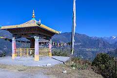 Viewpoint with a large prayer wheel into the valley near Jang.