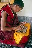 A monk reading Tibetan Buddhist texts in the Tsuglagkhang, the Dalai Lama's temple.