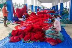 Men repairing their nets, Chellanam Fishing Harbour.
