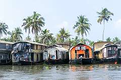 Houseboats in Mullakal, along the riverbank near Alappuzha.