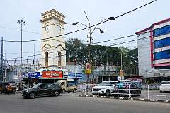 The Chinnakada Clock Tower, an iconic 1940s tower with a clock facing in each direction. made of brick and white cement, along Chinnakada Road in Kollam (Quilon).