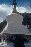 A Buddhist monk painting a chorten at Rizong Gompa.