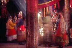 Masked dancers perform a spiritual dance.