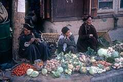 Ladakhi women selling vegetables on the street in Leh bazaar .