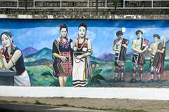 A wall painting depicting Naga costumes and culture at the Local Ground along the road heading south in Kohima.