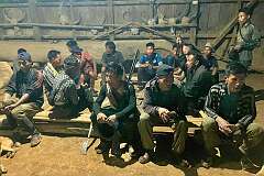 Konyak Naga hunters with their guns, in the Chingke morung, formerly the tribal youth dormitory, now Sheanghah Chingnyu's community centre.