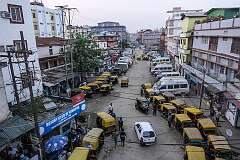Tuktuks and buses on Golaghat Road in Dimapur.