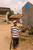 Nibu, a guide in the  Angami Naga village of Khonoma, at the monument to people who died in battles with the Indian Army, in 1956 - 1992.