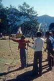 Men and boys practicing archery on the grounds of the Tsuglakhang Monastery.