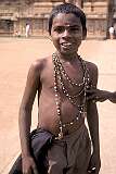 A young pilgrim, his forehead anointed with the sacred “tika”, at the Brihadisvara Temple.