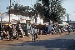 Shops selling metal ware, and a mosque, Tiruchirappalli.