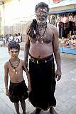 A father and son on pilgrimage in the Srirangam Rangathaswamy Temple, among the largest functioning religious complex in the world; it was extensively restored throughout 1999 and 2000.