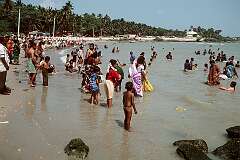 The sea bath, often seen as a religious and purifying ritual for pilgrims before or after visiting the main temple.