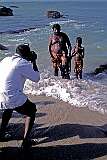 A father and his small sons being photographed in the sea at Kanyakumari.