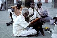 Reading from sacred texts. The Meenakshi temple is major South Indian pilgrimage centre.