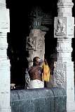 A priest doing his rites during sunrise in the Sri Meenakshi Temple, theologically significant: it represents a confluence of the Shaivism, Shaktism and Vaishnavism denominations of Hinduism.