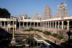 The Golden Lotus Tank and the towering “gopuram” temple towers in the Sri Meenakshi Temple in Madurai.
