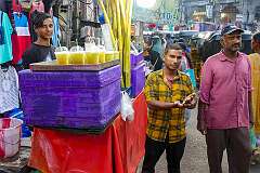 Seller of lemonade, on the corner of Mir Chowk Road with Pathergatti  Road, in the heart of Hyderabad.