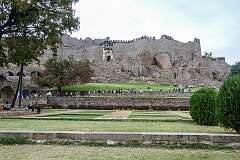 View to the crenellated walls of Golconda Fort from Nagina Bagh, one of the gardens in Golconda fort.