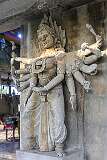 A statue of Kali, her multiple hands are often shown holding various symbols and weapons, signifying her connection to time, destruction, and liberation; in the Sri Veeramma Kali Temple.