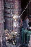A monkey on a temple bell in Durga Mandir.