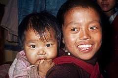 Bhutanese brothers Rinchin Dorjee with Rinchin Paden strapped to his back at Jangsa Gompa.