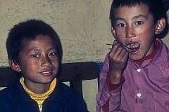 Kunzong Dorjee and Pema Gyaltsen, two young Bhutanese boys, lunch at Jangsa Gompa.