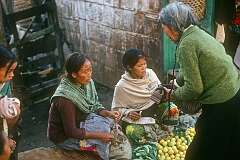 Selling suntala (tangerines, citrus fruit) at Raja Dorjee Market.