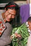A Tibetan man with spring onions at Raja Dorjee Market in Kalimpong.