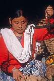 A Nepali girl weighing potatoes on the Raja Dorjee market in Kalimpong.
