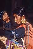 A Nepali woman weighing potatoes on the Raja Dorjee market.